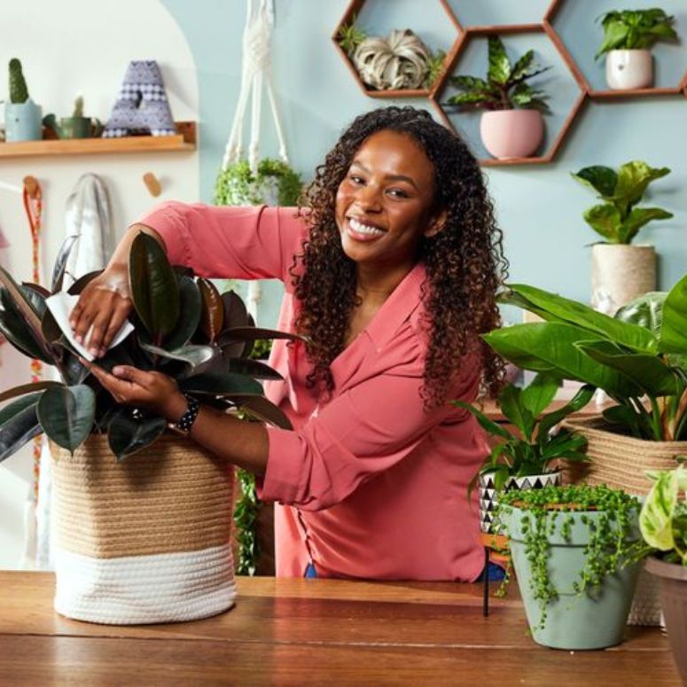 Amanda Roberts pictured in room with housplants