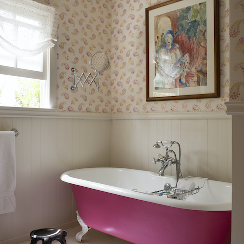 Pink free-standing bath in bathroom with dado wood panelling and Kathryn Ireland Quilt wallpaper in the Home Network gallery Unusual Bathroom Renovation Ideas That Will Be Popular In 2025