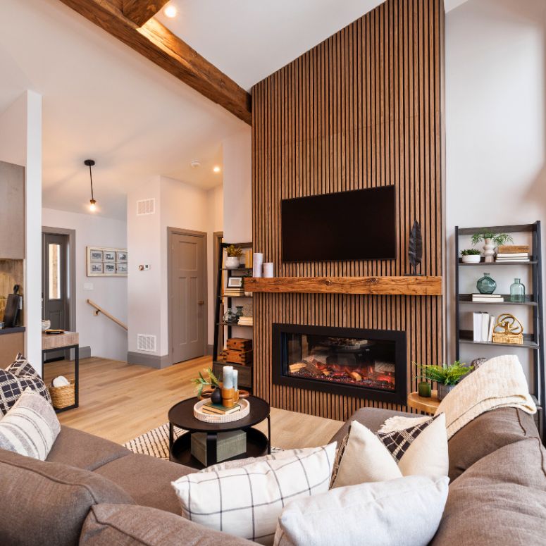 high ceiling living room with wood accent and fire place