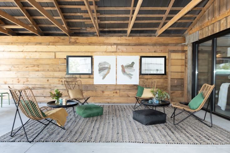 Covered patio seating with exposed rafters 
