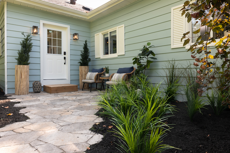 Blue cottage with stone walkway