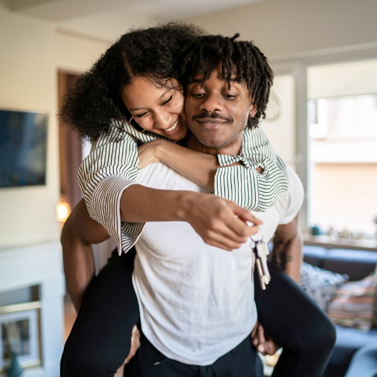 happy couple with keys to a new home