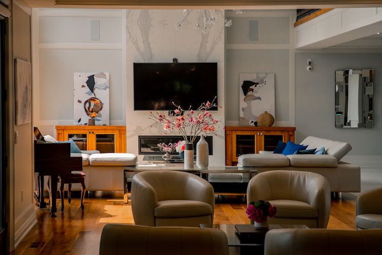Living room with mounted TV and marble features