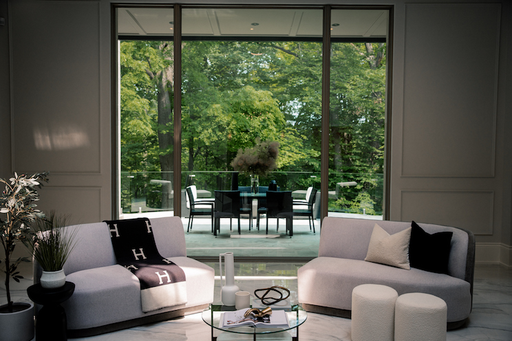 Living room window looking out at trees