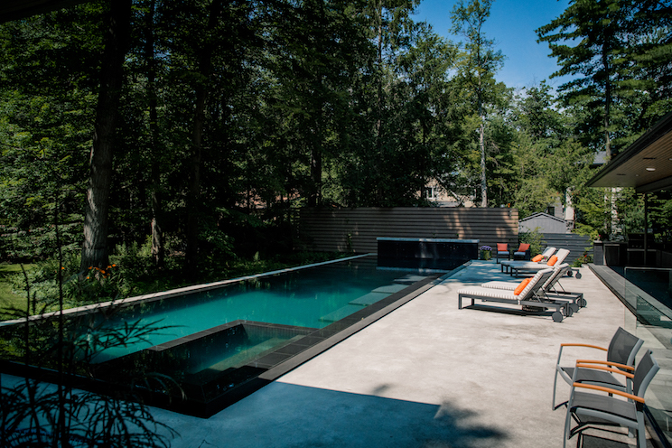 Outdoor lap pool with trees for shade