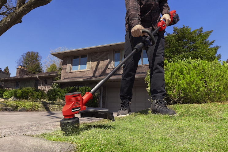 Man using weed wacker