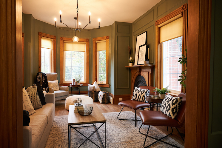 A Victorian sitting room with leather chairs