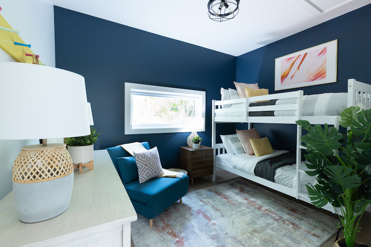 Blue bedroom with white bunk beds
