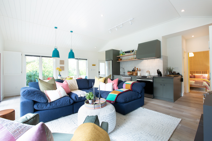Open concept cottage with blue couch