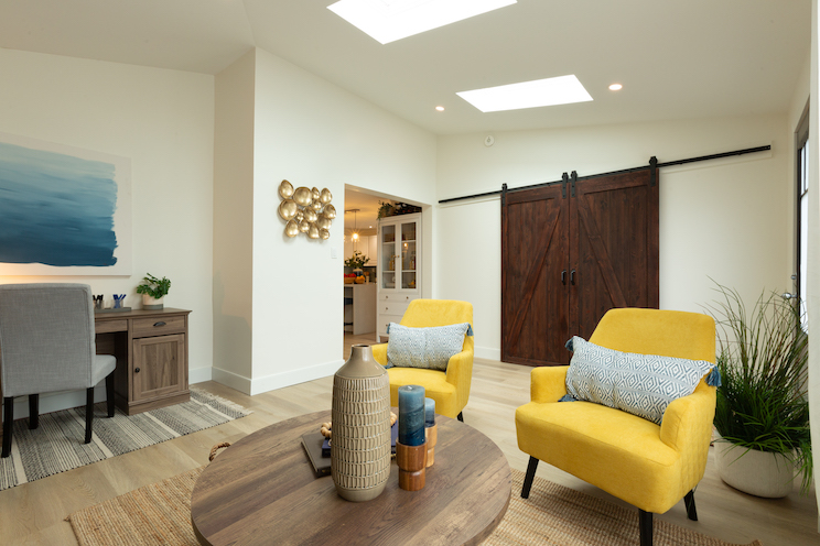 Living room with desk and sliding barn doors