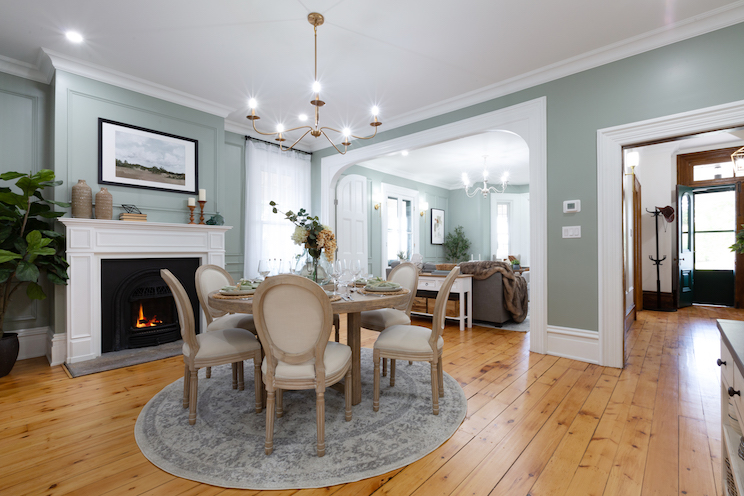 Circular dining room table in ranch inspired room