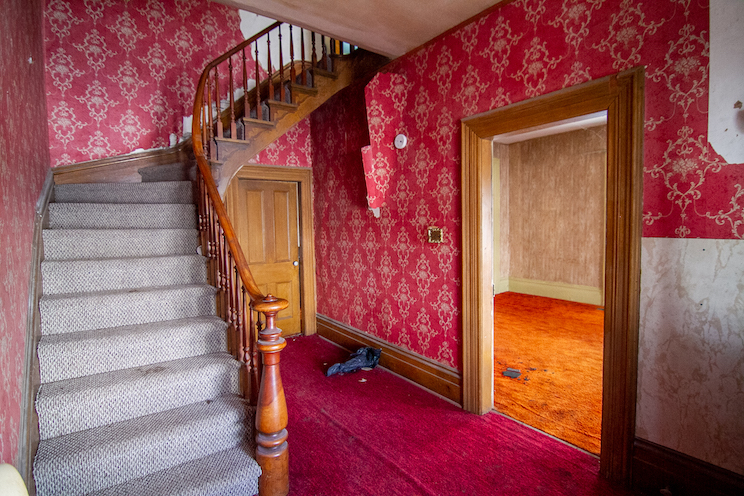 Old farmhouse entryway with red details