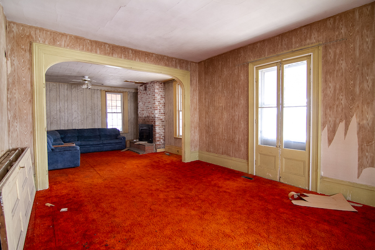 Old farmhouse with red-orange carpet