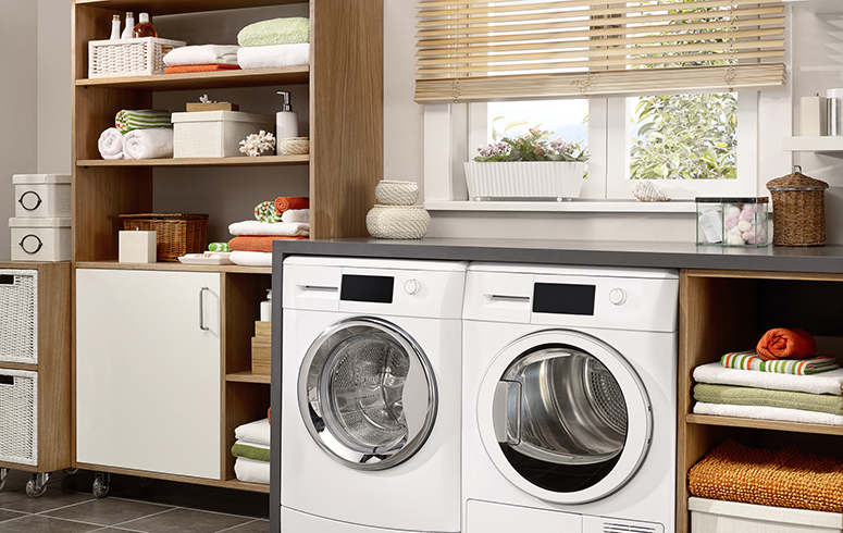 Domestic laundry room with washing machine and dryer