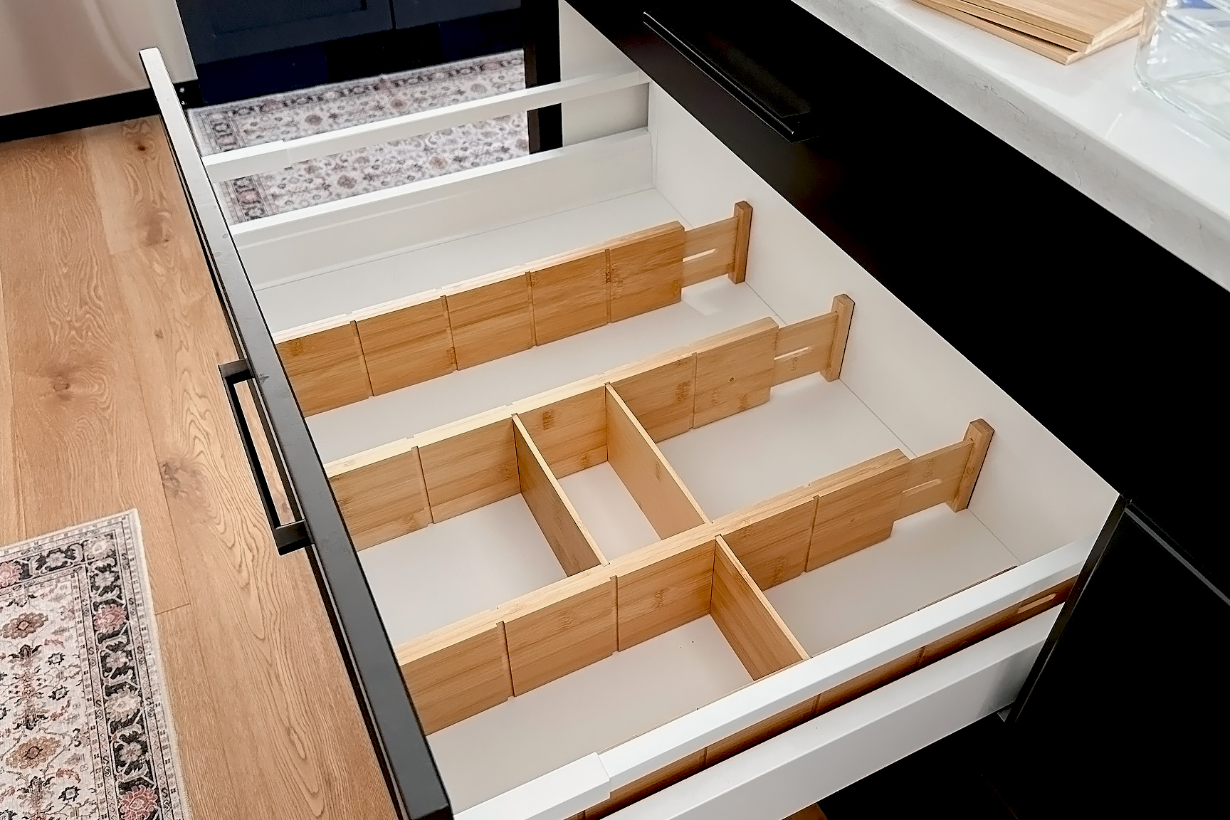 An empty drawer in a kitchen island