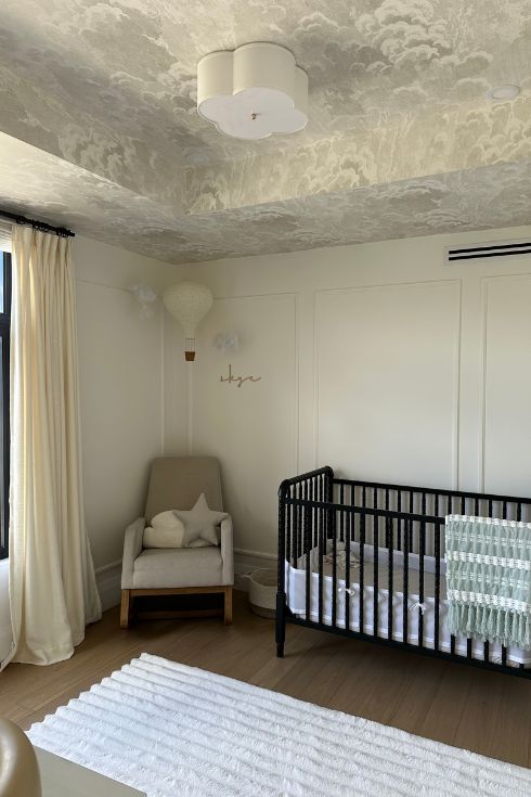 A chair and crib in a nursery