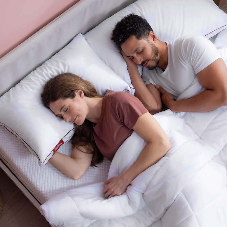 Couple sleeping on a bed