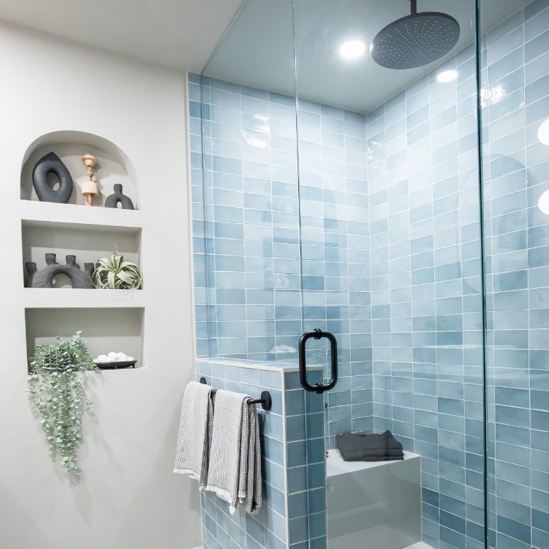 Blue tile shower with rainhead shower