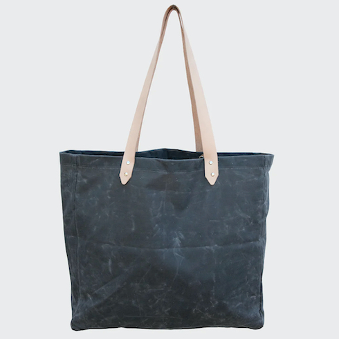 Waxed Canvas Beach Bag in Storm by Salt Shop on Salt Spring Island on a grey background as part of HGTV Canada's 10 Gift Ideas for the Men in Your Life