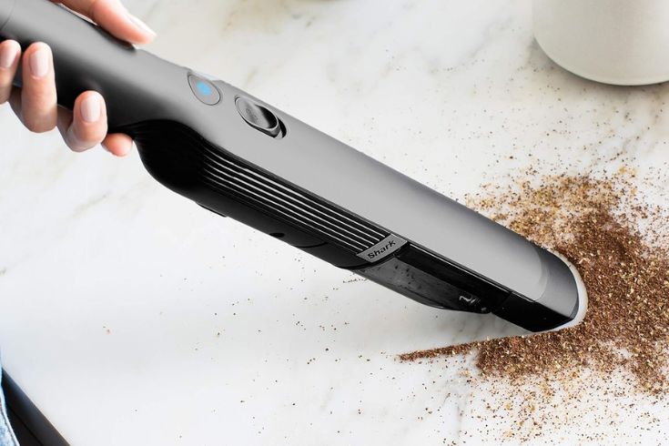Shark WV200C WANDVAC Handheld Vacuum in use