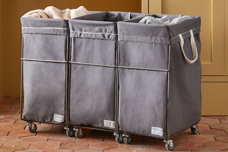Rejuvenation Steele Grey Canvas Laundry System on a red tiles floor as featured in Laundry Mistakes on HGTV Canada