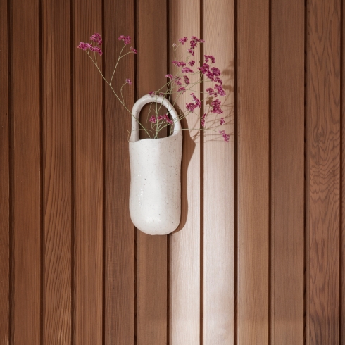 A wall hanging pocket for plants by Ferm Living