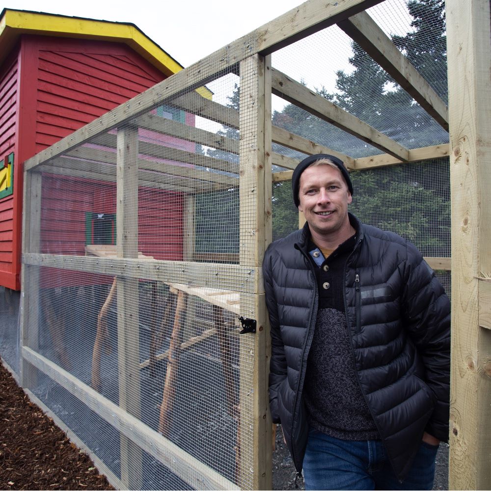 Randy Sparcklin and his finished designer chicken coop