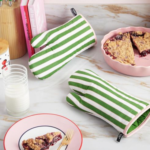 Green and white striped oven mitts on a kitchen counter