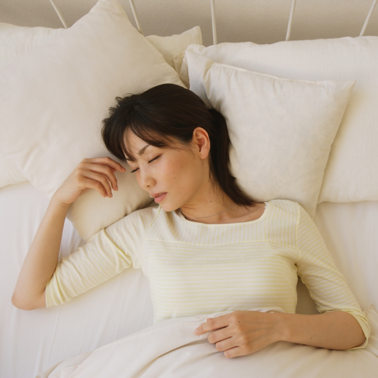 Woman sleeping peacefully in bed