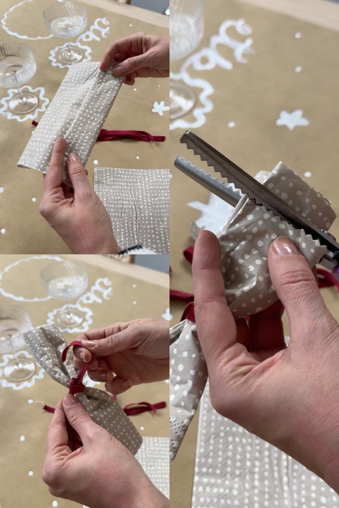 creating a napkin bow with a scissor and velvet ribbon