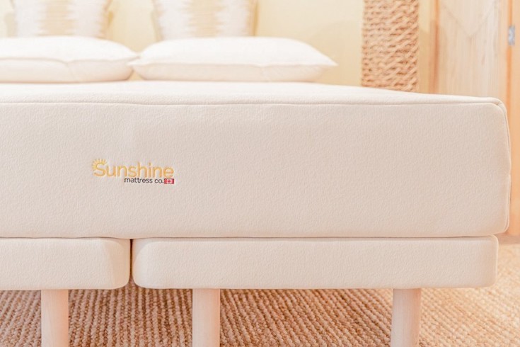 A Sunshine Mattress Co. organic latex and wool mattress in a bright bedroom for Home Network When You Should Replace Your Mattress
