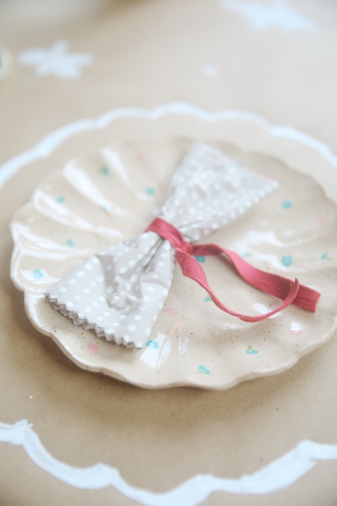 scalloped plate with a ribbon napkin