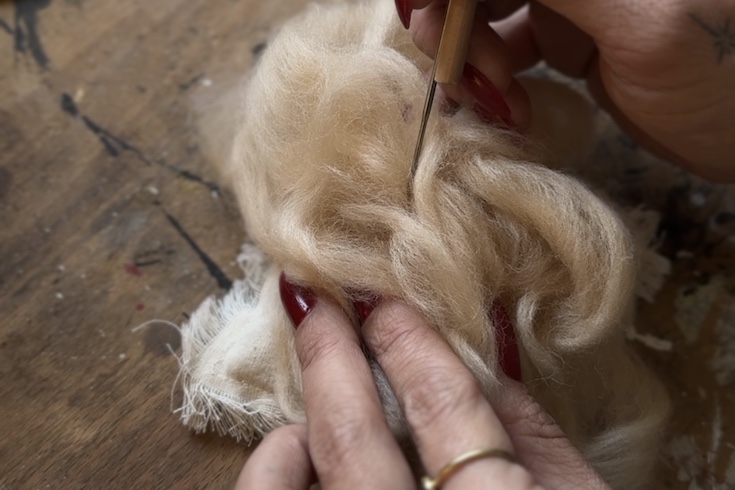 Start off with a rough shape and use your needle to compress and shape the wool