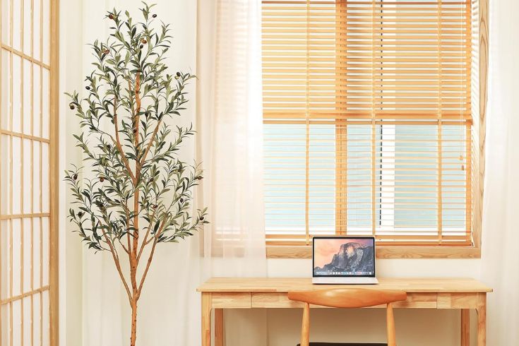 Kazeila Artificial Olive Tree beside desk in bright room
