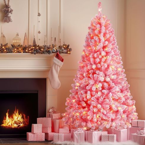 Pink Christmas tree beside fire place