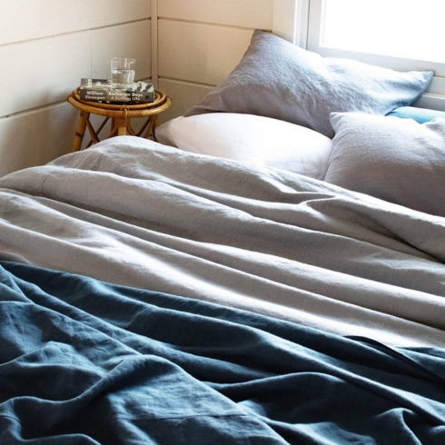 A beautiful linen duvet cover on a bed by Rough Linen