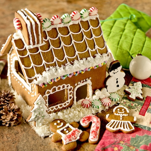 A festive gingerbread house with candy and cookie decorations surrounding it.Often, some of the stress of hosting a holiday event comes from worrying about whether your guests will be bored or feel awkward — especially if you’re bringing together a group of people who may not all know each other well. A stress-reducing solution? Plan some activities, games or entertainment to help break the ice and keep guests entertained. Activities like decorating cookies or gingerbread houses can be fun for kid-friendly events, while holiday-themed trivia may help adult guests get in the festive spirit. Gingerbread House Bake Set, Wayfair.ca, $29.