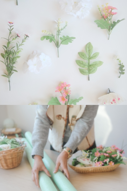faux flowers and pool noodles on a table 