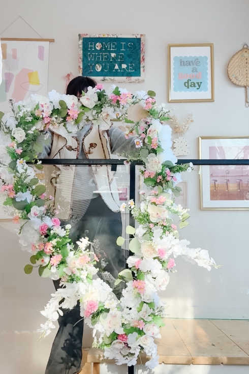 hanging wall art with florals and greenery