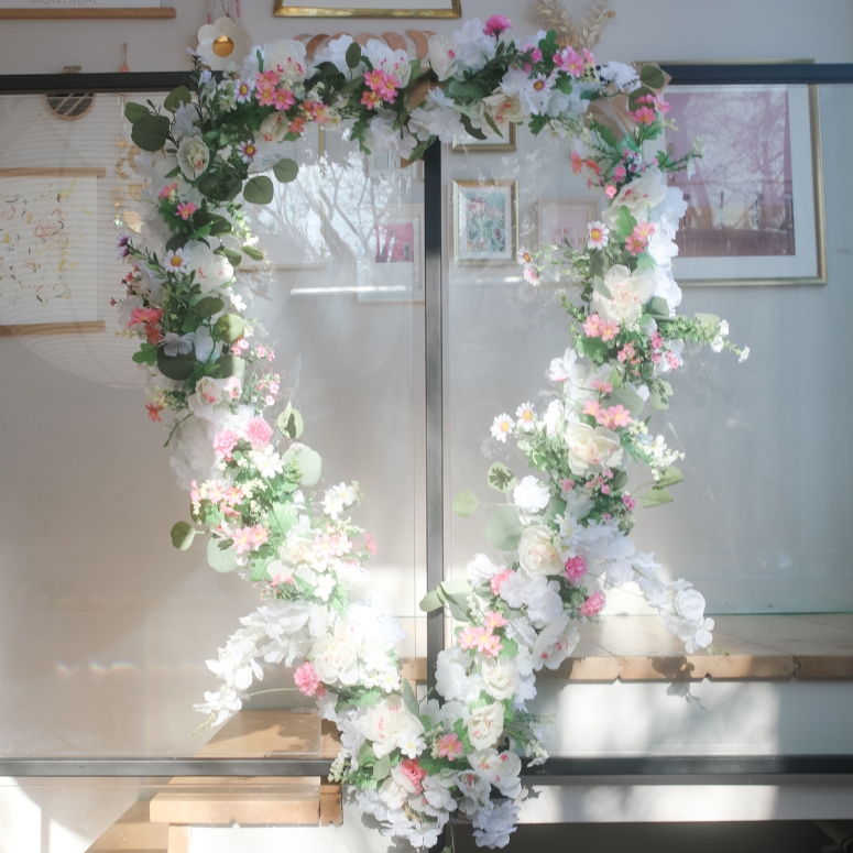Giant floral heart shaped wall art in front of a staircase