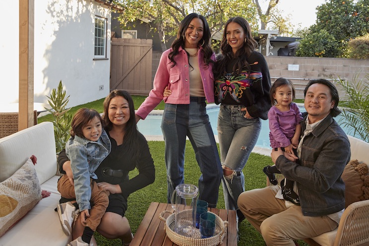 Jessica Alba and Lizzy Mathis with one of the families from Honest Renovations