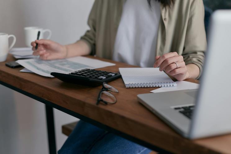 Woman at desk going over budget