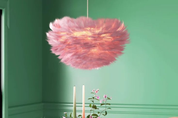 Pink feather light in green room