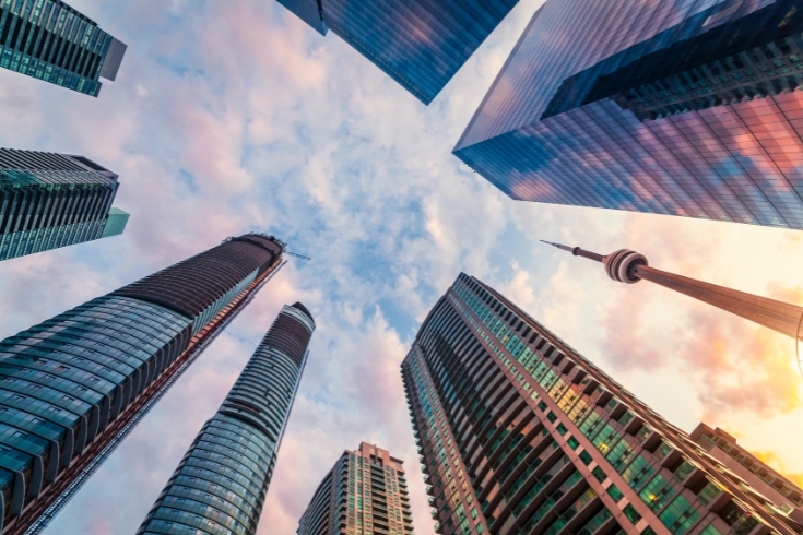 Worm's eye view of Toronto downtown skyscrapers and CN tower.