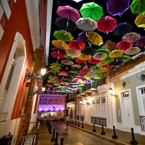 Assorted Coloured Umbrellas Hanging Near Buildings in San Juan, Puerto Rico