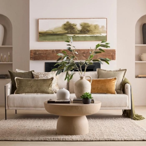 A stone-hued concrete effect round coffee table.