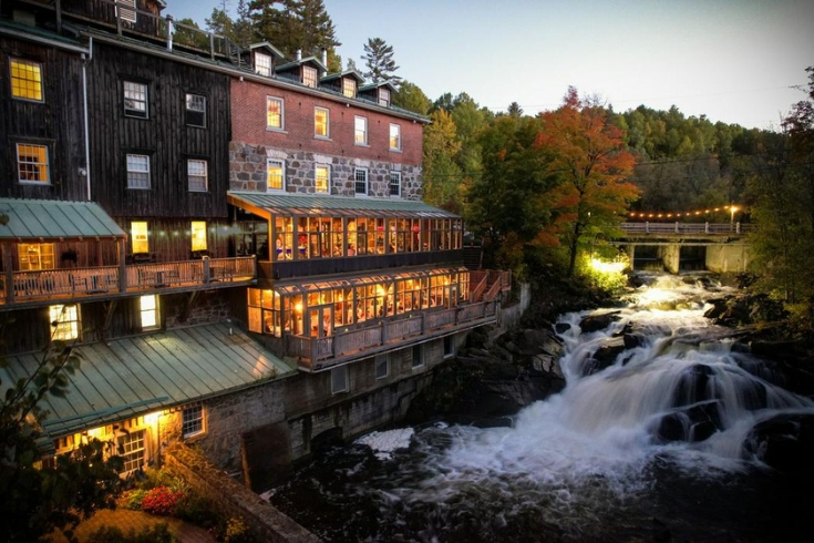 View Moulin Wakefield Mill Hotel next to the waterfall.