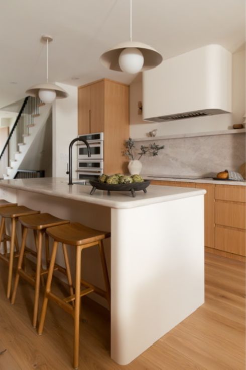 Curved island in wood kitchen