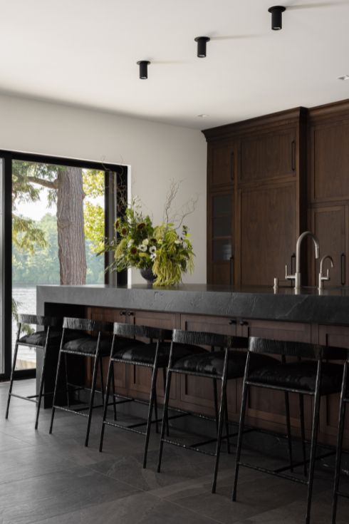Dark wood kitchen with black countertops