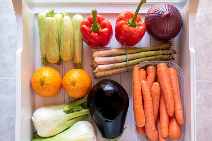Fruits and vegetables in a fridge.